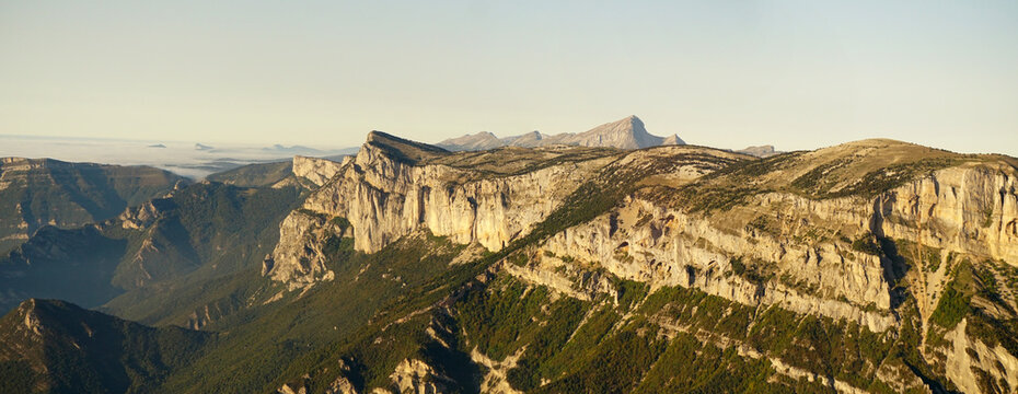 Aerial view of the rugged peaks and rocky cliffs of the Alps mountain range in France.