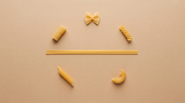 Creative Pasta Arrangement with Spaghetti and Various Pasta Shapes