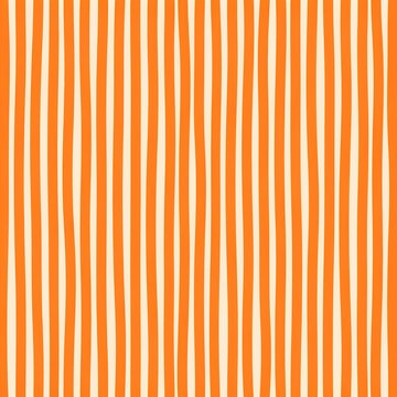 Seamless background pattern of hand drawn vertical wavy orange stripes on a light cream surface