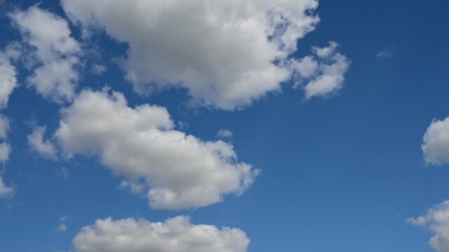 timelapse of dense horizontal cloud layer in the blue sky