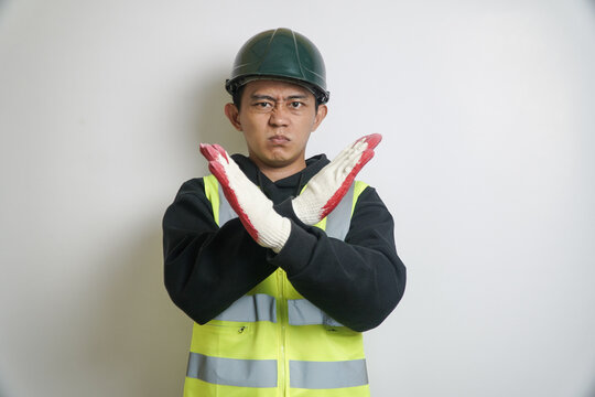 Asian Construction Worker in Hard Hat and Vest Making Stop Gesture
