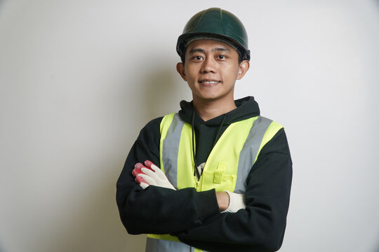 Portrait of a Smiling Asian Worker Wearing Safety Vest and Hard Hat