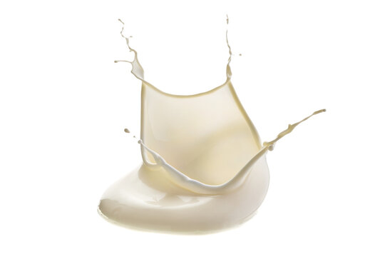 Milk splash forming crown and shallow puddle on white background with frozen droplets, creamy texture, bright highlights, dynamic motion, clean studio look, with milk, splash, droplet, puddle detail