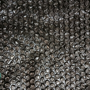 Black bubble wrap packaging material texture background