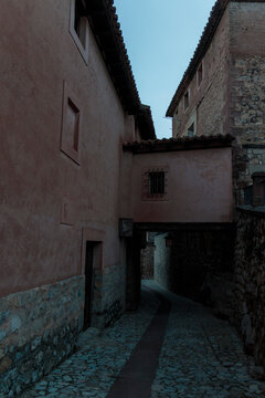 Albarrac&iacute;n medieval alleyway with traditional spanish architecture at dusk