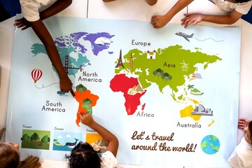 Children of diverse ethnicities point at a colorful world map poster. © Rawpixel.com