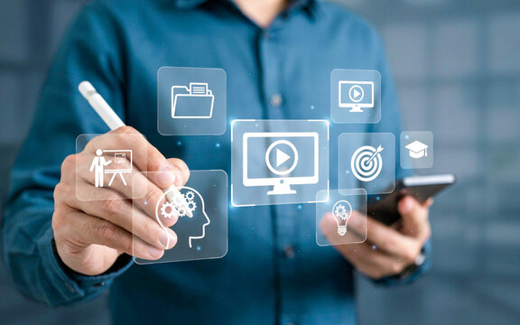 Man in blue shirt using stylus on virtual learning interface with icons