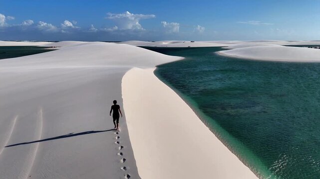 Traveling Beside a Turquoise Lagoon and Lone Walker in Len&ccedil;&oacute;is
