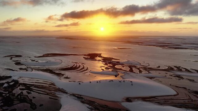 Drifting Over Reflective Sunset Water Channels at Len&ccedil;&oacute;is Maranhenses