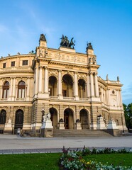 Naklejka premium Historic European cathedral with classical architecture and fountain.