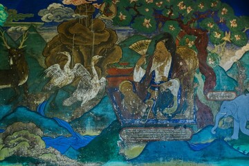 Traditional ancient Tibetan Buddhist mural in Leh gompa, Ladakh, India with Six Symbols of Longevity © Matrix Reloaded