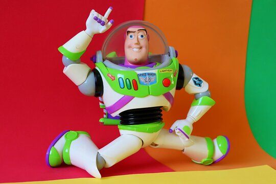 Salvador, Brazil - August 15, 2026: Buzz Lightyear action figure on a colorful background. Disney Pixar Toy Story character.