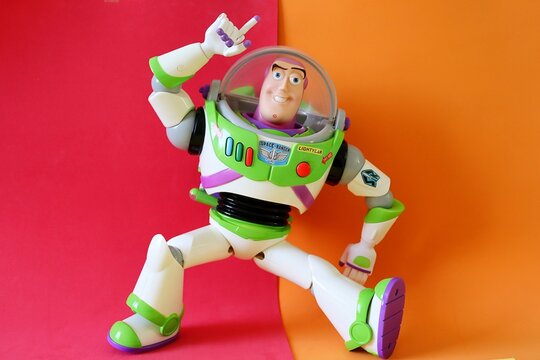 Salvador, Brazil - August 15, 2026: Buzz Lightyear action figure on a colorful background. Disney Pixar Toy Story character.