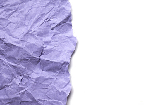 Crumpled purple paper texture background with torn edge