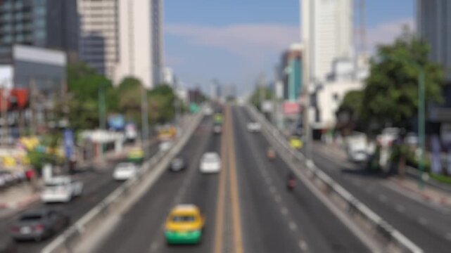 Bokeh view of road traffic in Bangkok, Thailand. Blurred background footage.