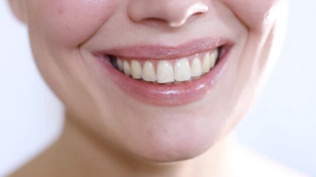 Close-up young happy woman smiling and laughing with beautiful white teeth