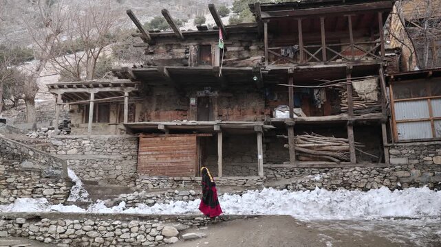 Portrait Young Kalashi Woman, Beautiful Traditionally Dressed girl in in Bumburet Valley at Winter, Chitral, Pakistan.