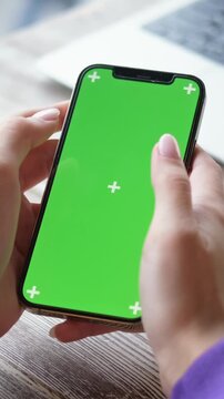Young woman freelancer enjoys focused remote work and virtual learning in cozy caf, utilizing green screen for seamless video calls and productivity boosting sessions.