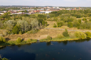 Fototapeta premium Aerial Image of Parson's Meadow Lake, Parkland and Wigan Townscape