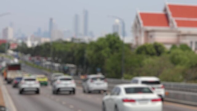 Bokeh view of road traffic in Bangkok, Thailand. Blurred background footage.
