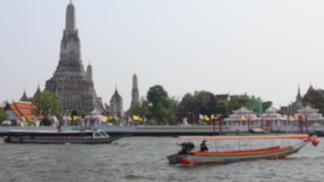 Bokeh view of ferry boats sailing on the Chao Phraya River, Bangkok, Thailand. Blurred background footage.