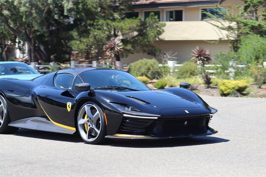 Monterey, California, USA - August 14, 2026: Ferrari Daytona SP3 hypercar driving on the road during Monterey Car Week