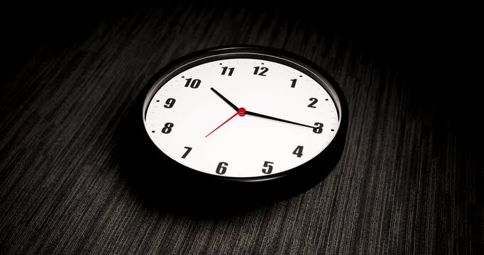 Dramatic animation of 3D wall clock dropping and bouncing on dark office carpet floor during late night