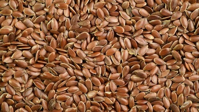Flax seeds close-up, top vie, rotating 