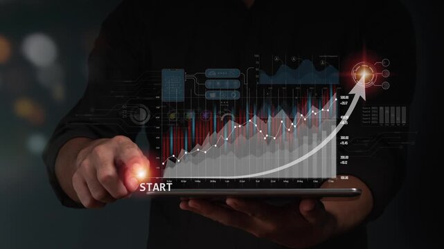 Businessman pressing start button on tablet screen showing growing financial stock chart and data analytics dashboard, representing business growth, trading investment, and success strategy.