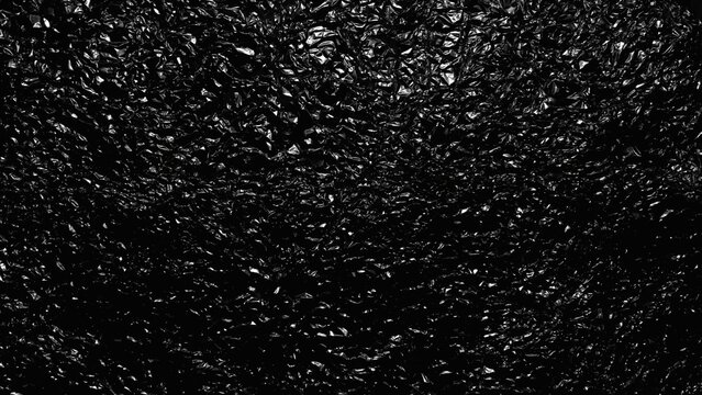 crumpled black foil texture reflecting light through every wrinkle for dark backdrop web design and moody branding