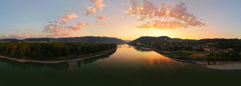 Sunrise over the Danube River with a distant view of Sch&ouml;nb&uuml;hel Castle in the Wachau Valley, Lower Austria, panoramic view.