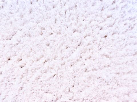 plush white shag rug texture macro closeup soft cozy fiber detail for web design advertising wellness branding