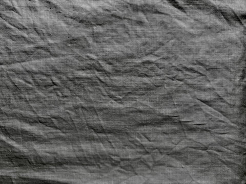 wrinkled charcoal linen fabric texture background for sustainable web design branding and authentic editorial layouts
