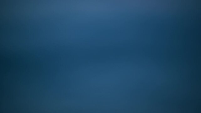 Smooth abstract deep navy blue background with soft out-of-focus gradient transitions. Clean minimal backdrop ideal for copy space and presentation design. 4K.