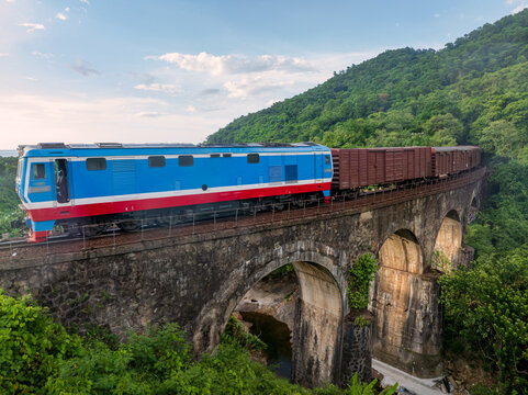 Passenger train on Hai Van Pass coastal railway, Da Nang Vietnam