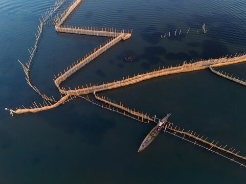 Aerial fish fences and boat at Dam Chuon, Hue