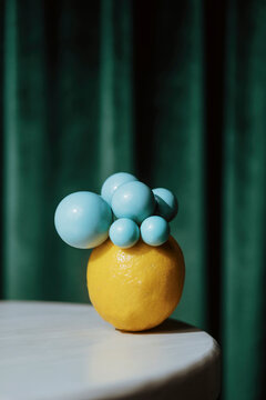 Unique Display of Lemon and Blue Spheres on a Table