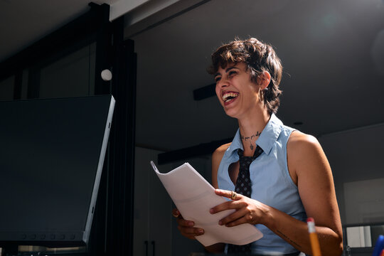 Laughing woman at business office meeting