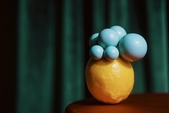 Unique Display of Lemon and Blue Spheres on a Table