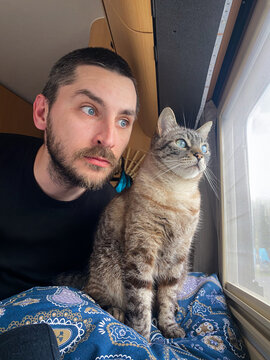 Man and Cat Share Gaze
