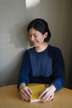 Woman sitting at the table at home