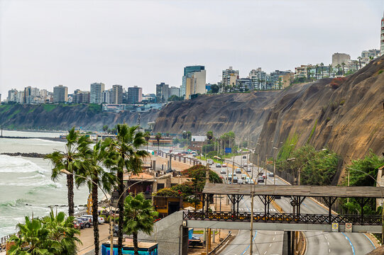 A view of a rustic pedestrian footbridge above the coastal highway in Lima, Peru in the dry season