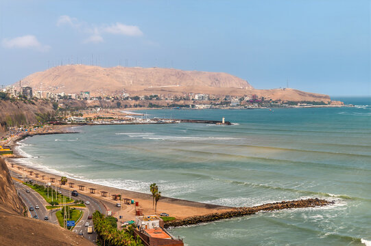 A view along the shoreline from the Barranco district on the Pacific coast of Lima, Peru in the dry season