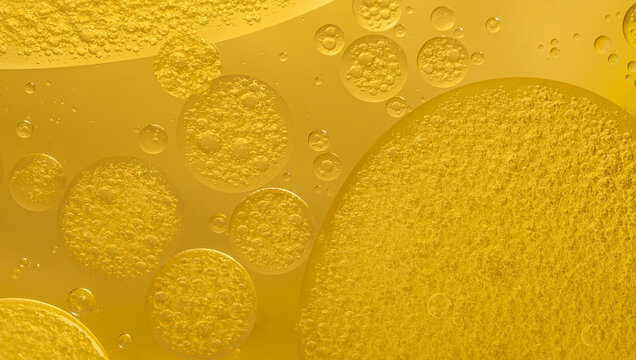 Abstract yellow water bubbles essential oil beauty collagen Serum Repair cell background.