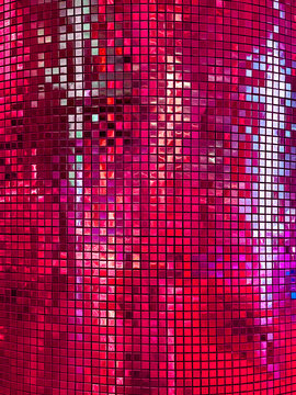 Vibrant hot pink and magenta sequin grid wall texture shiny mosaic tile backdrop reflective glittering square pattern background for disco party event night club and glamorous interior design.