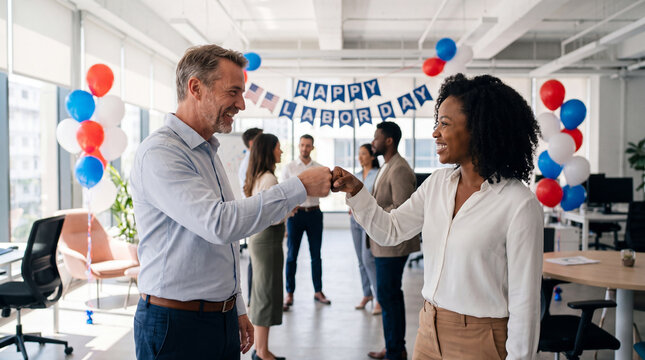 Labor Day celebration features two business colleagues fist bumping in bright office for corporate social media banner