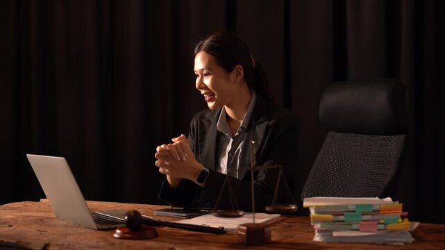 A Judge in Chambers: A female judge, poised and professional, sits at her desk in a dimly lit chamber, a laptop open before her, and a gavel ready for use, exuding an aura of authority and wisdom.