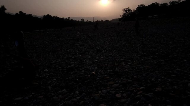 Devghat Dham Sunrise in Nepal, Golden Morning Sun over Sacred Riverbank with Hindu Pilgrims, Peaceful Spiritual Landscape, Religious Pilgrimage, Himalayan Culture and Scenic Travel Destination