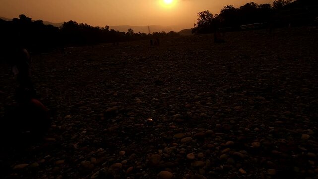 Devghat Dham Sunrise in Nepal, Golden Morning Sun over Sacred Riverbank with Hindu Pilgrims, Peaceful Spiritual Landscape, Religious Pilgrimage, Himalayan Culture and Scenic Travel Destination
