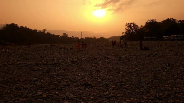 Devghat Dham Sunrise in Nepal, Golden Morning Sun over Sacred Riverbank with Hindu Pilgrims, Peaceful Spiritual Landscape, Religious Pilgrimage, Himalayan Culture and Scenic Travel Destination